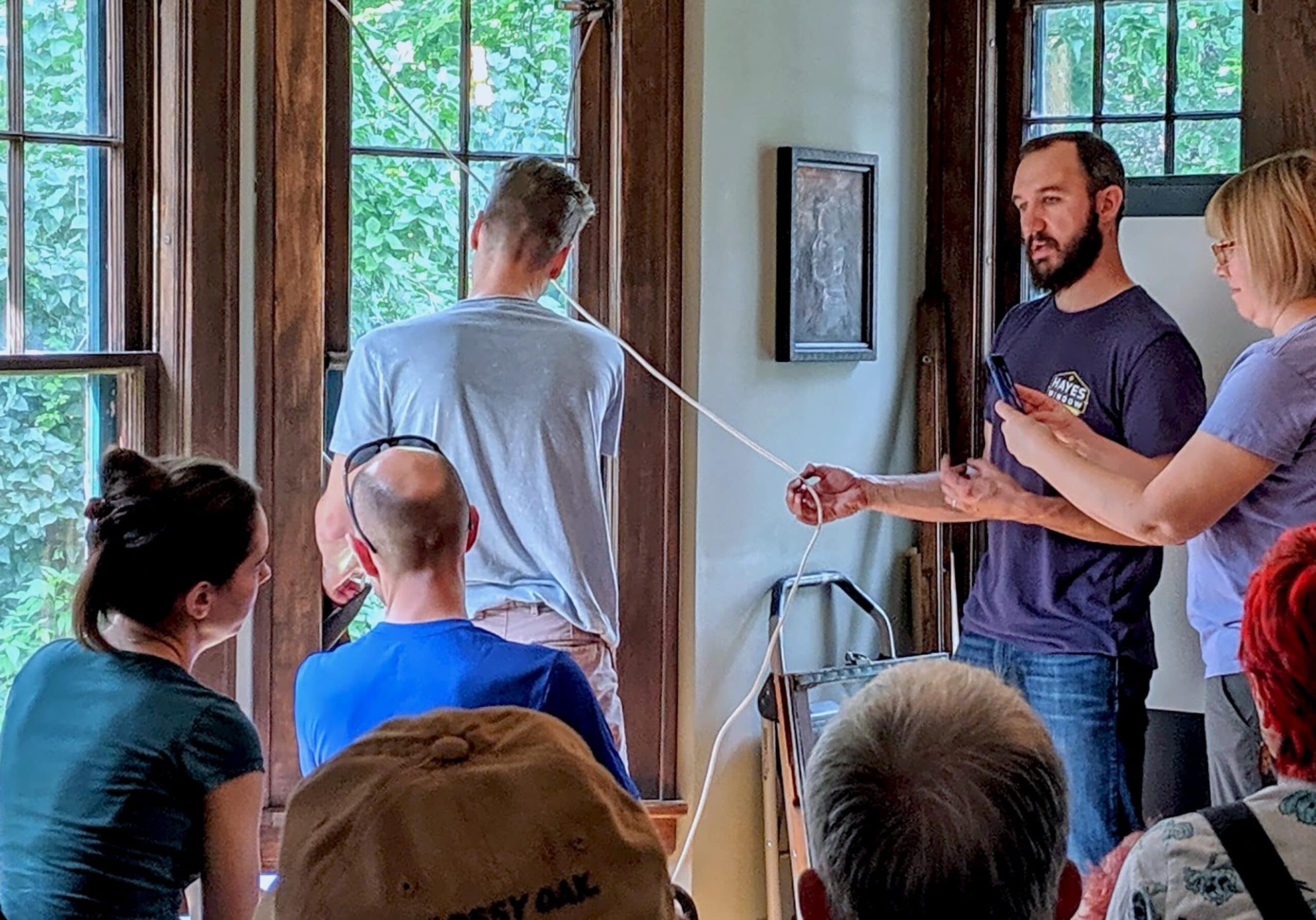 Joe Hayes Group workshop discussing techniques indoors.