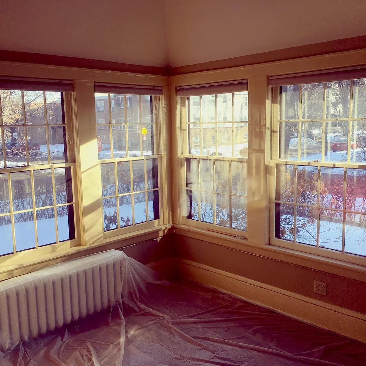 Hayes-Window-Restoration-Environmental-Benefits-4-SQ Replacement window panes in a cozy, sunlit room during window restoration.