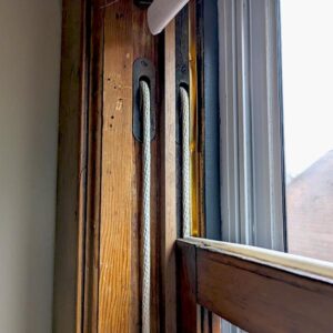 Vintage window handles on wooden frame.
